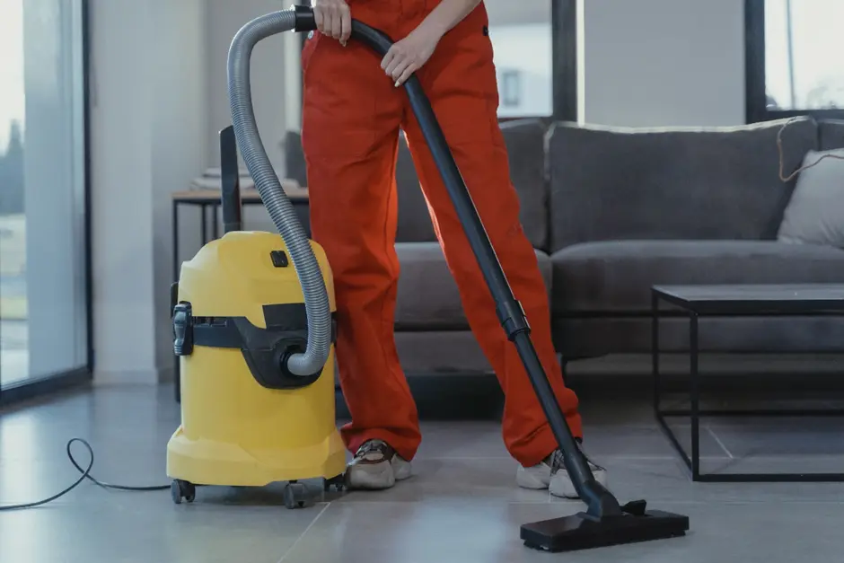  Man vacuuming the floor, cleaning services, house cleaning companies, deep clean, house cleaner, best cleaning service