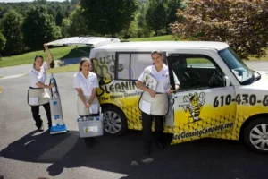 Busy Bee house cleaning services glen mills pa cleaning team posing infront of a company car