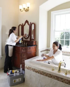 Busy Bee house cleaners cleaning a bathroom 