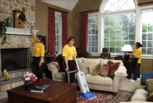 Busy Bee cleaning team cleaning a living room 